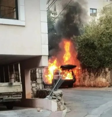 A car on fire in Beirut after a blast Wednesday