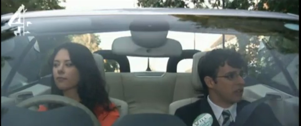 a man and a woman are sitting in a car on a youtube video