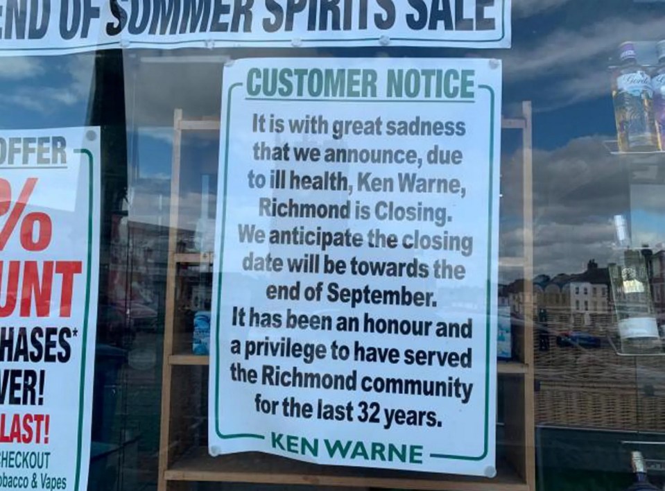 A sign in the shop's window explains the reason behind the store closing