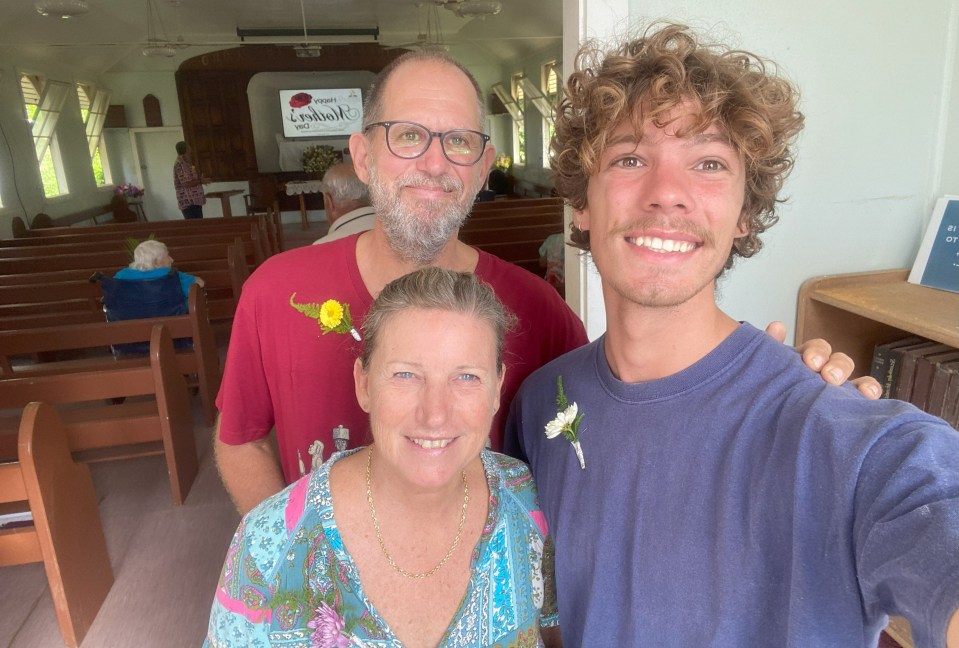 Angus pictured with his parents, who nearly lost their son