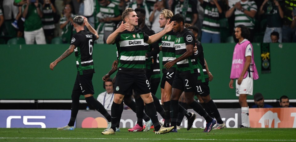 a group of soccer players wearing green and white jerseys with getafe on them