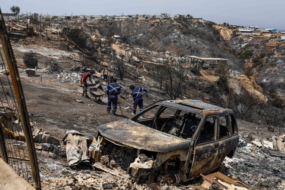 A destroyed vehicle amid the fire fallout