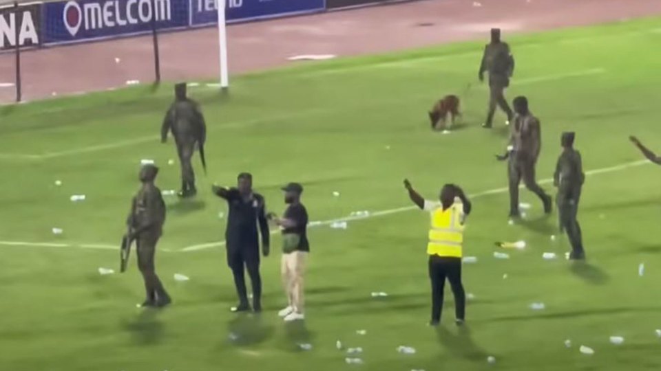 Ghana yobs invaded the pitch after their side lost to Angola