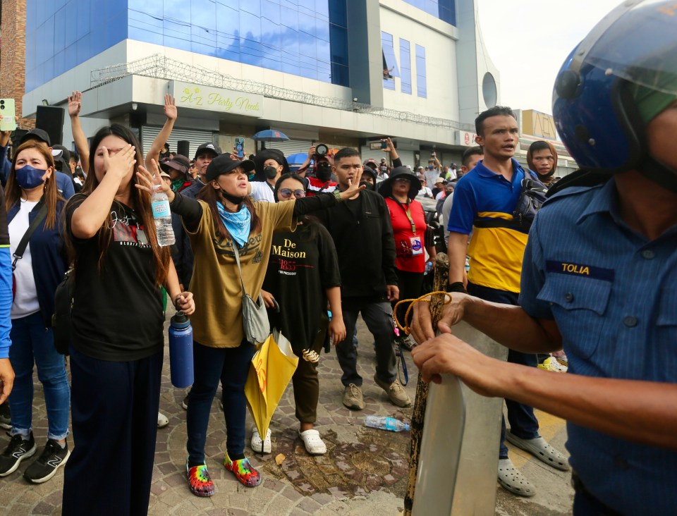 They were snapped by protesting against the manhunt for their leader