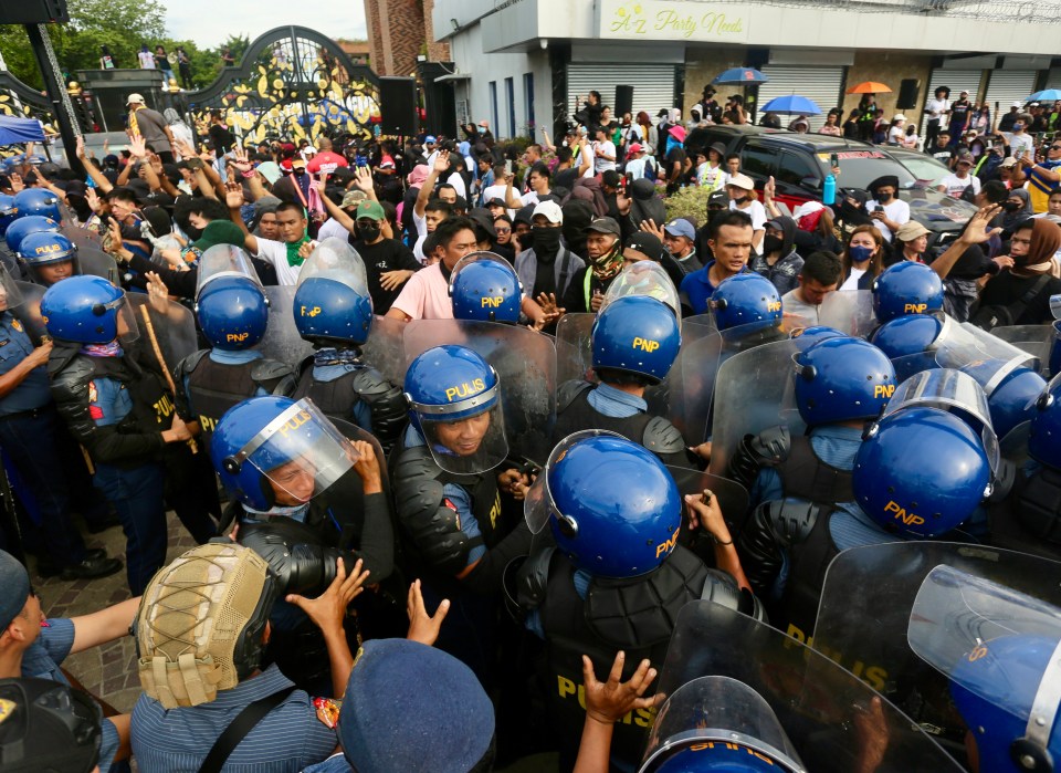 Quiboloy supporters clash with cops outside the Kingdom of Jesus Christ (KOJC) compound in Davao city