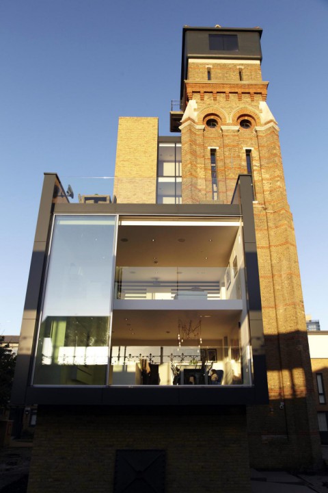 a brick building with a balcony on top of it