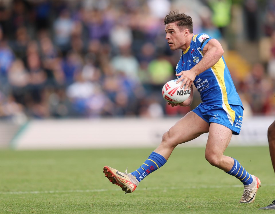 a rugby player wearing a blue and yellow jersey that says n30 on it