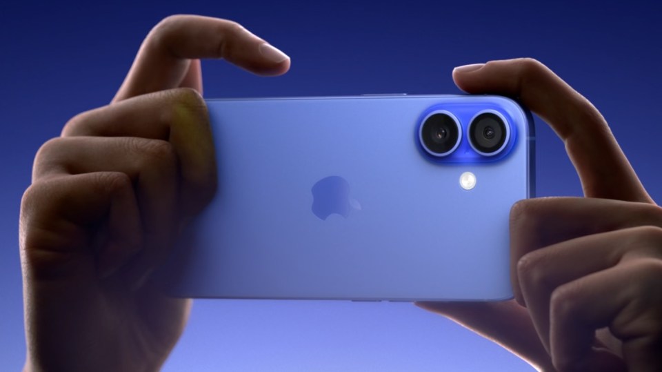 a person is holding a blue iphone in their hands