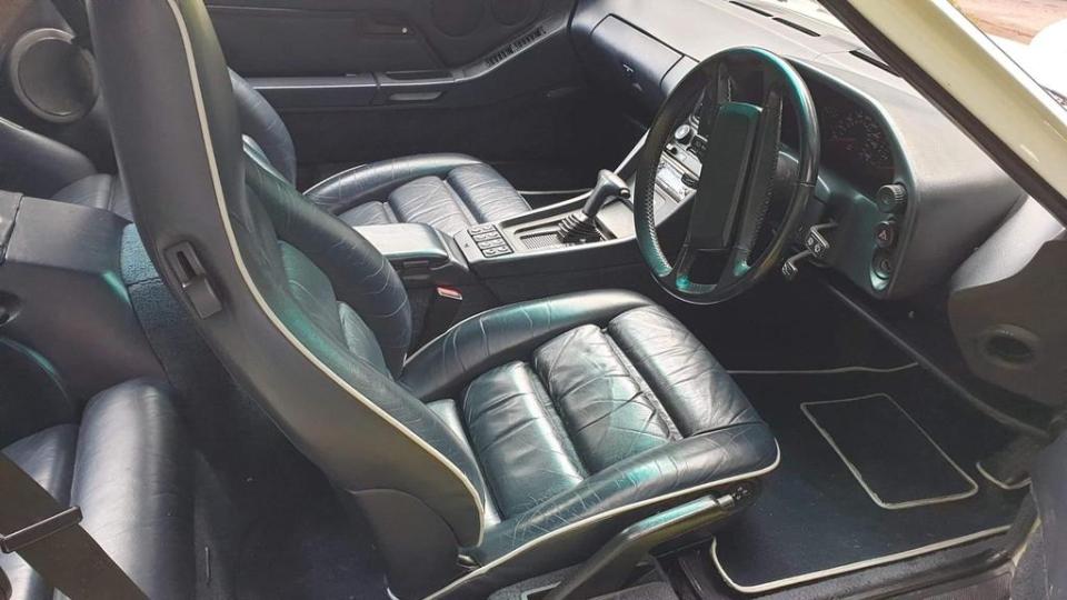 It features a gorgeous leather interior