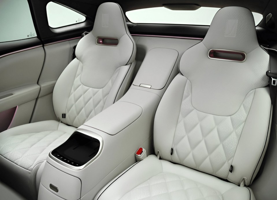 the back seats of a car with a red trim