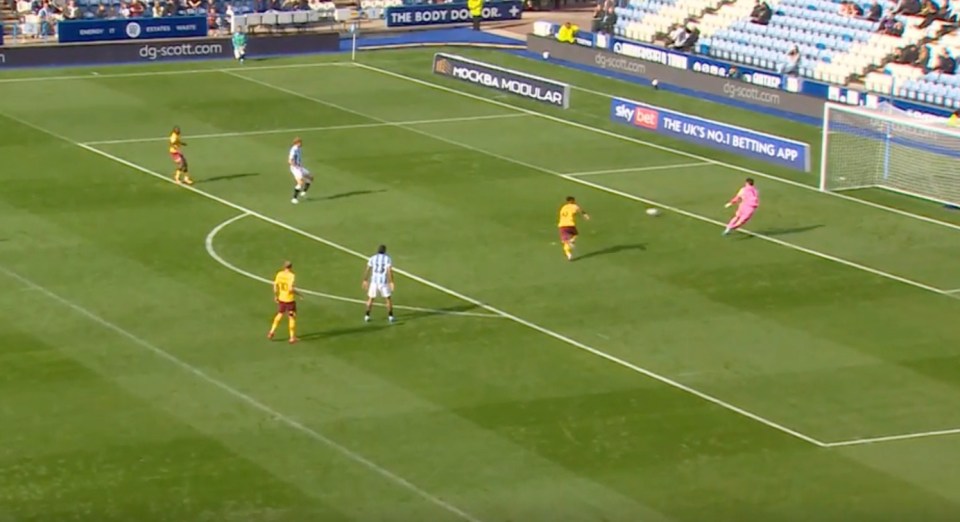 a soccer game is being played on a field sponsored by sky bet