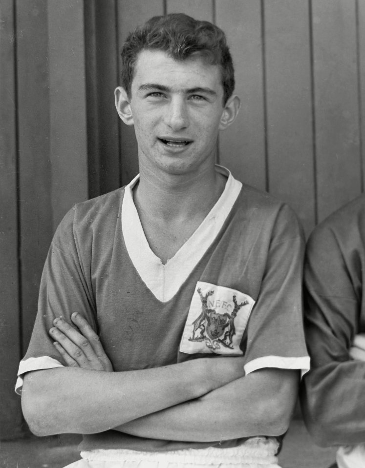 a man with his arms crossed wears a rangers shirt