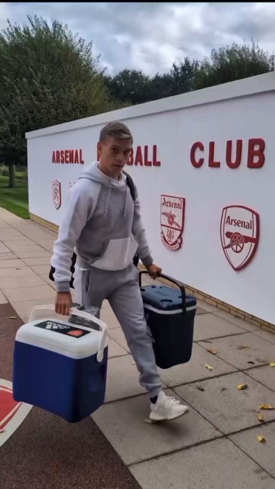 The winger was seen carrying drink coolers as he arrived at Arsenal training