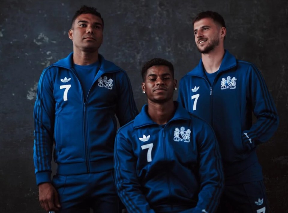 three men wearing blue adidas jackets with the number 7 on them