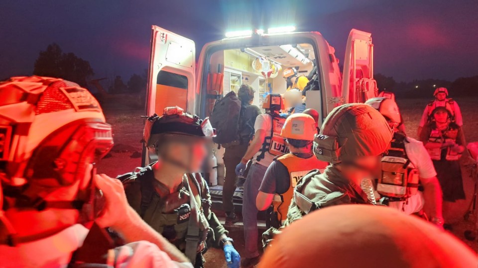 Medics working with the IDF to move dead bodies