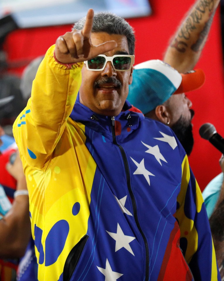 Venezuelan President Nicolas Maduro celebrates after the presidential election