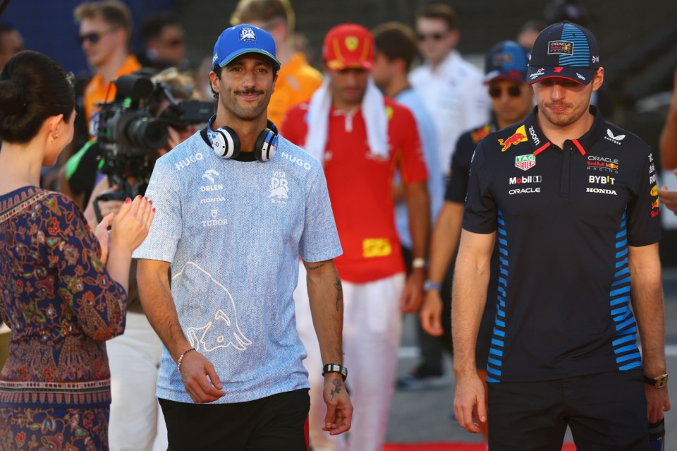 Mandatory Credit: Photo by Morgan Hancock/NurPhoto/REX/Shutterstock (14734165d) Daniel Ricciardo of Australia and Visa Cash App RB F1 Team and Max Verstappen of the Netherlands and Red Bull Racing-Honda RBPT appear during the drivers' parade ahead of the F1 Grand Prix of Singapore at Marina Bay Street Circuit in Singapore, Singapore, on September 22, 2024. F1 Grand Prix Of Singapore - 22 Sep 2024