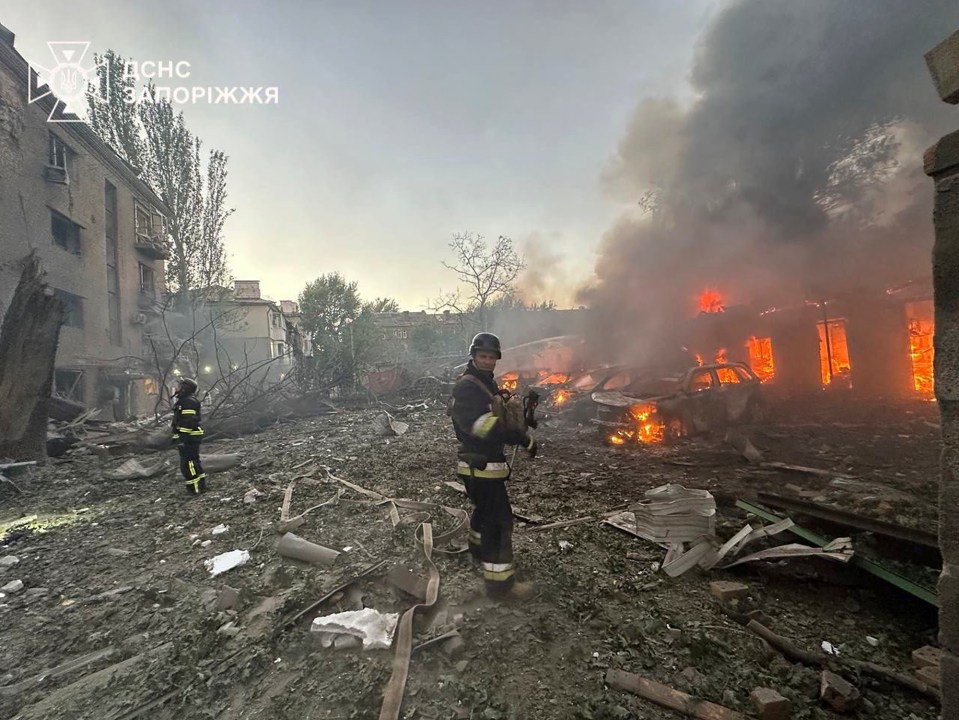 Firefighters put out a fire after overnight Russian bombing in Zaporizhzhia