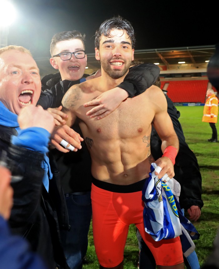 Raya celebrates with fans after helping Rovers get promoted