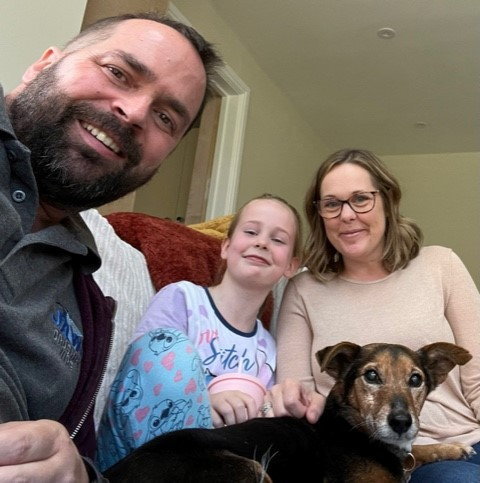 Adam Chapman with daughter Georgia and wife Rachel. Photo released September 2024. A father from Worcestershire with an incurable brain tumour is calling for more government funding into research into the disease.Forty-three-year-old Adam Chapman, from Worcester, was running his own business, training in the gym up to five days a week, and competing in 10k assault course races before his glioblastoma (GBM) diagnosis. Adam first started suffering from headaches six months after his wedding day in December 2022 and was rushed to hospital in February the following year..