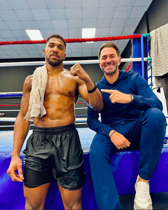 Anthony Joshua in the gym with promoter Eddie Hearn