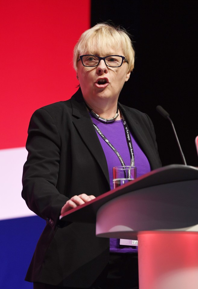 a woman is giving a speech at the labour party annual conference