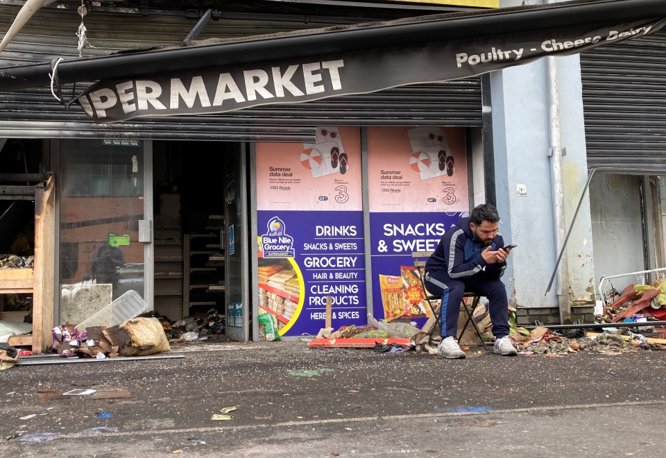 A shop ravaged by flamed during riots on August 6 in Belfast