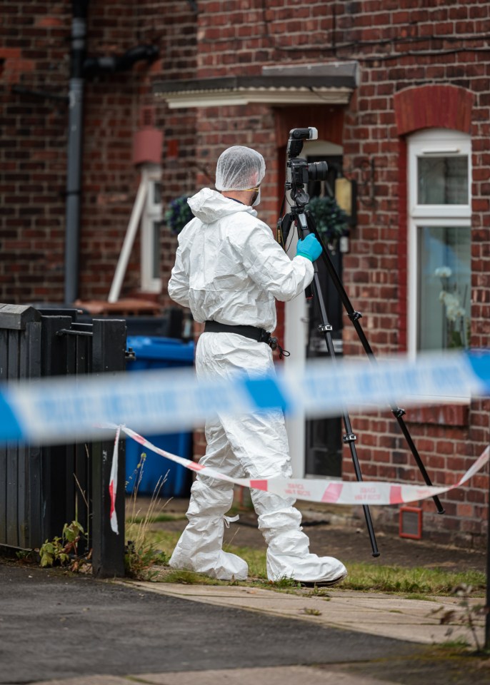 A forensic officer at the scene earlier today