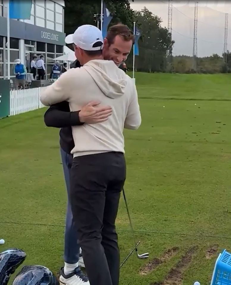 two men hugging in front of a building that says caddie lounge