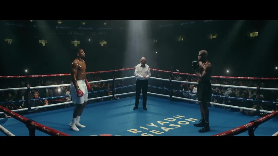 two boxers in a ring with the words riyadh season on the floor