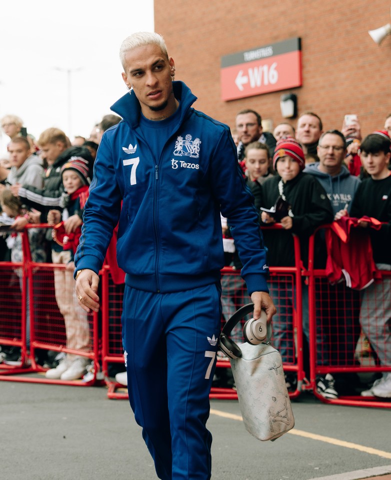 a man wearing a blue jacket with the number 7 on it