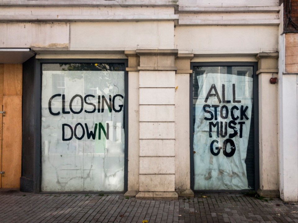 A Closed Down Empty Shop On A Town High Street