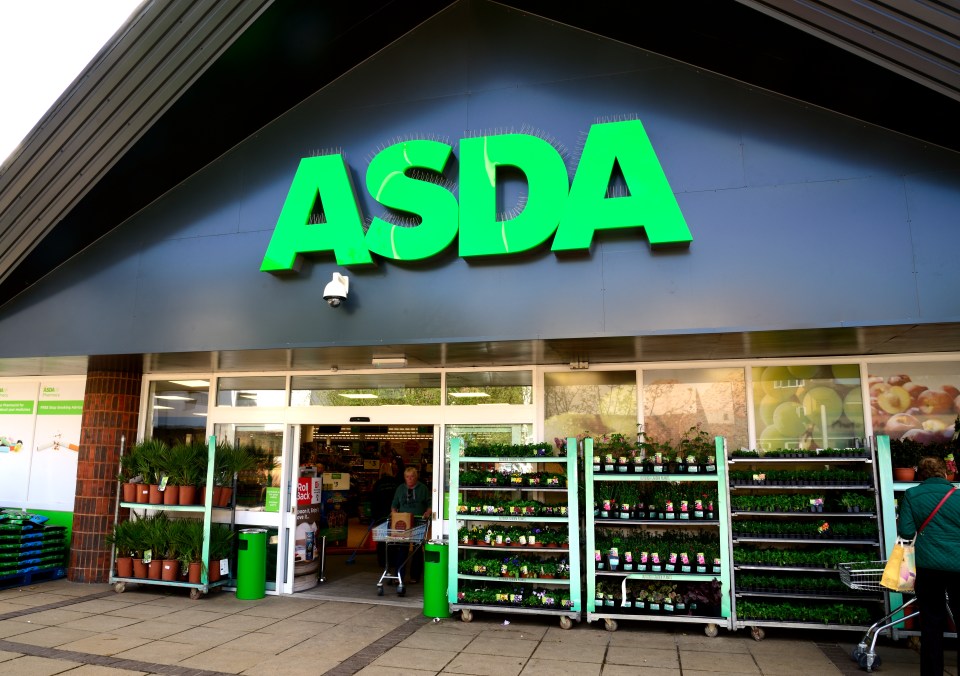 a green asda sign is above the entrance to a store