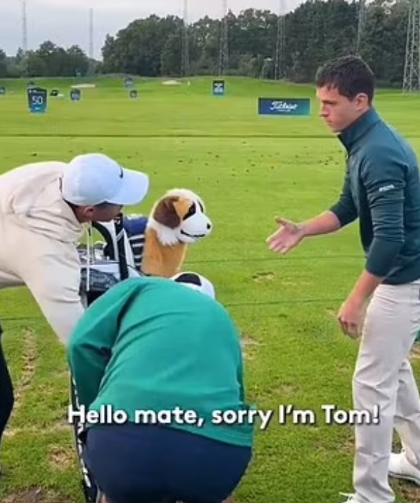 a group of people are standing on a golf course with a stuffed dog .