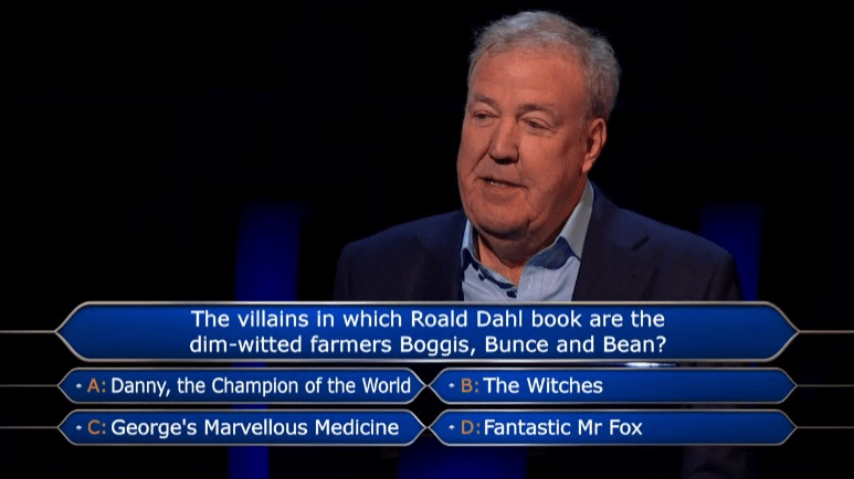 a man in a suit is answering a question about roald dahl