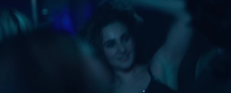 In flashbacks from the show, Andrew is seen dancing in a club with a young woman, who looks like Virginia