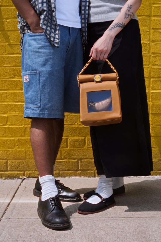 a woman holding a bag with a lidl logo on it