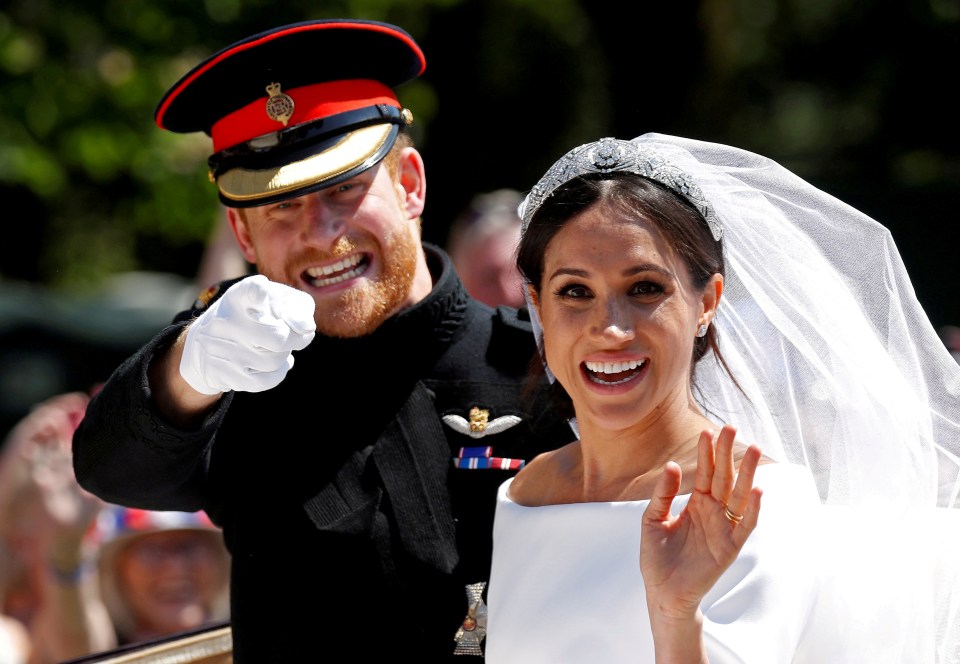 a man in a military uniform points at a woman in a wedding dress