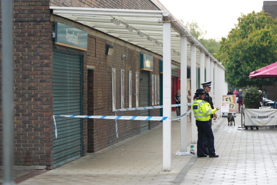 Cops remained outside the Poundland this morning