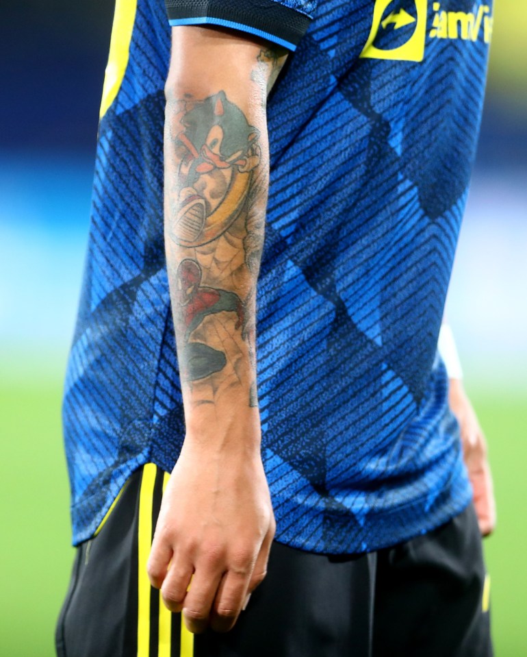 a soccer player has a tattoo of sonic the hedgehog on his arm