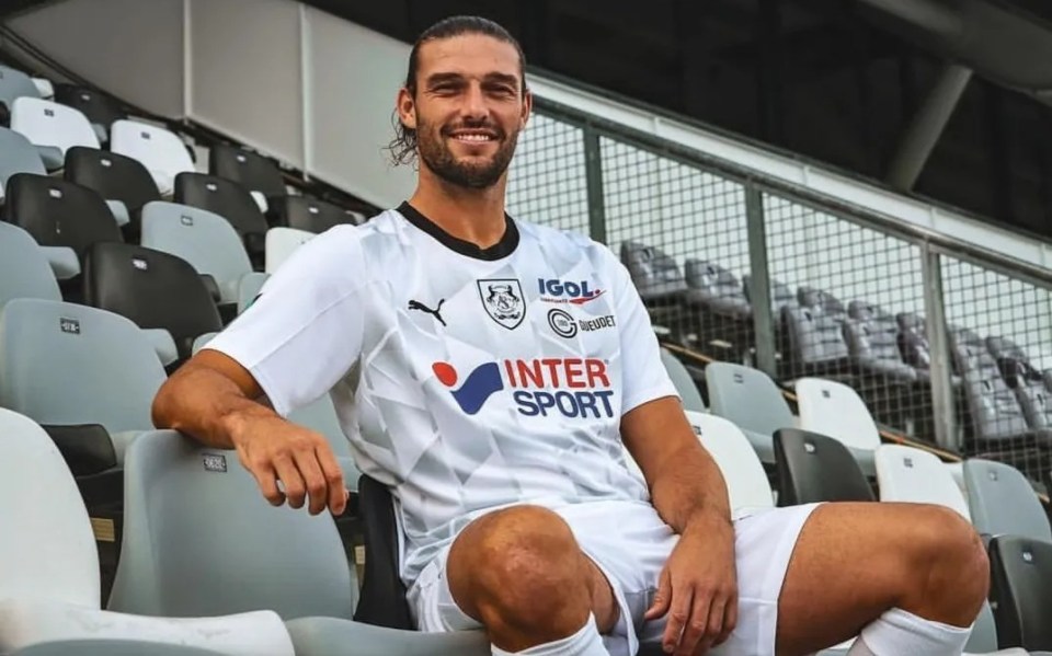 a man wearing a white shirt with the word inter sport on it