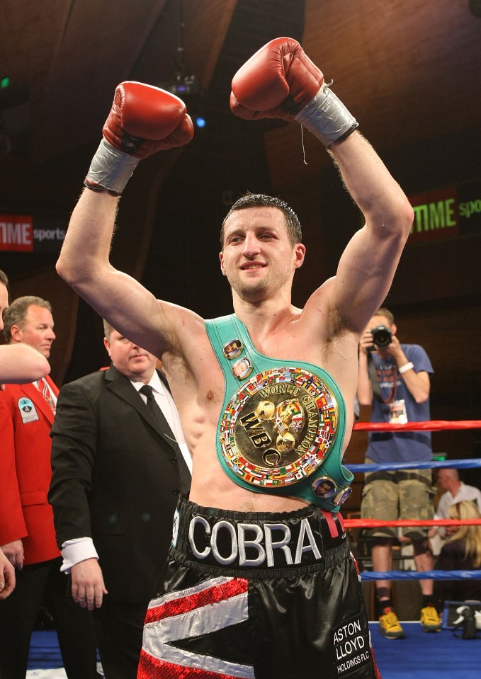 a man wearing boxing shorts with the word cobra on them