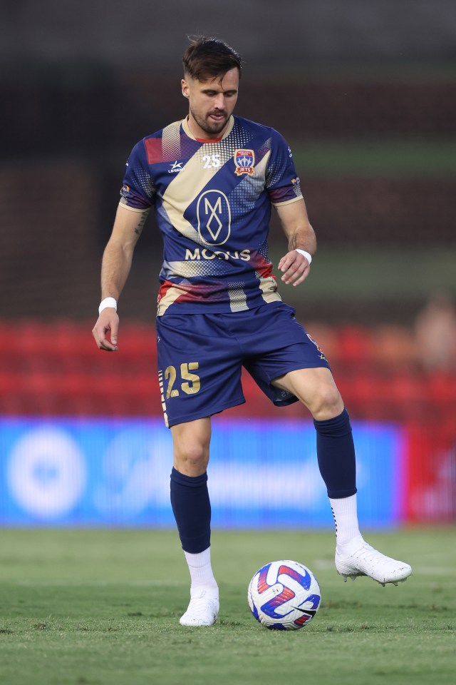 a soccer player with the number 25 on his shorts