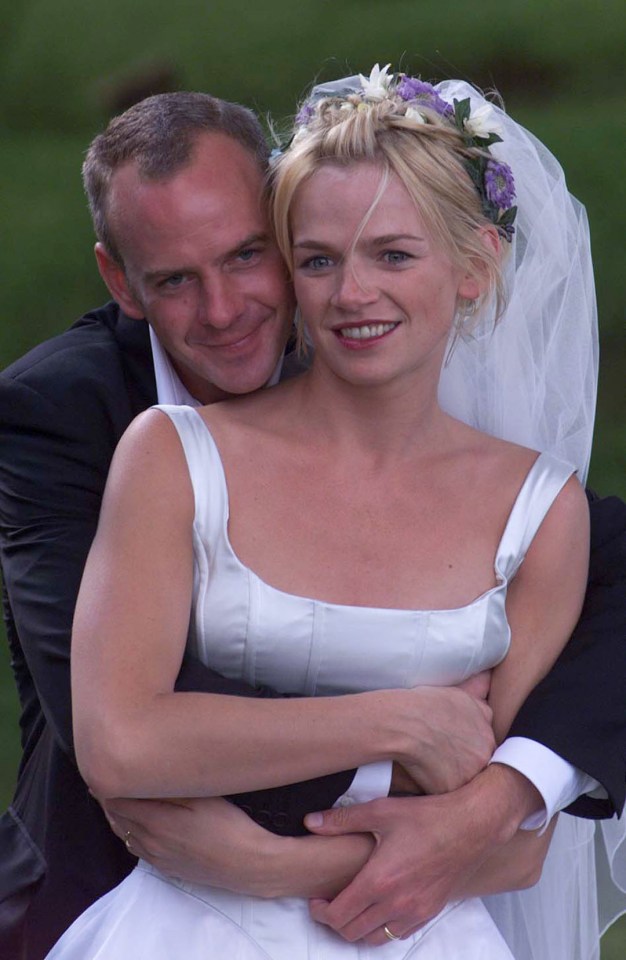 a bride and groom pose for a picture on their wedding day