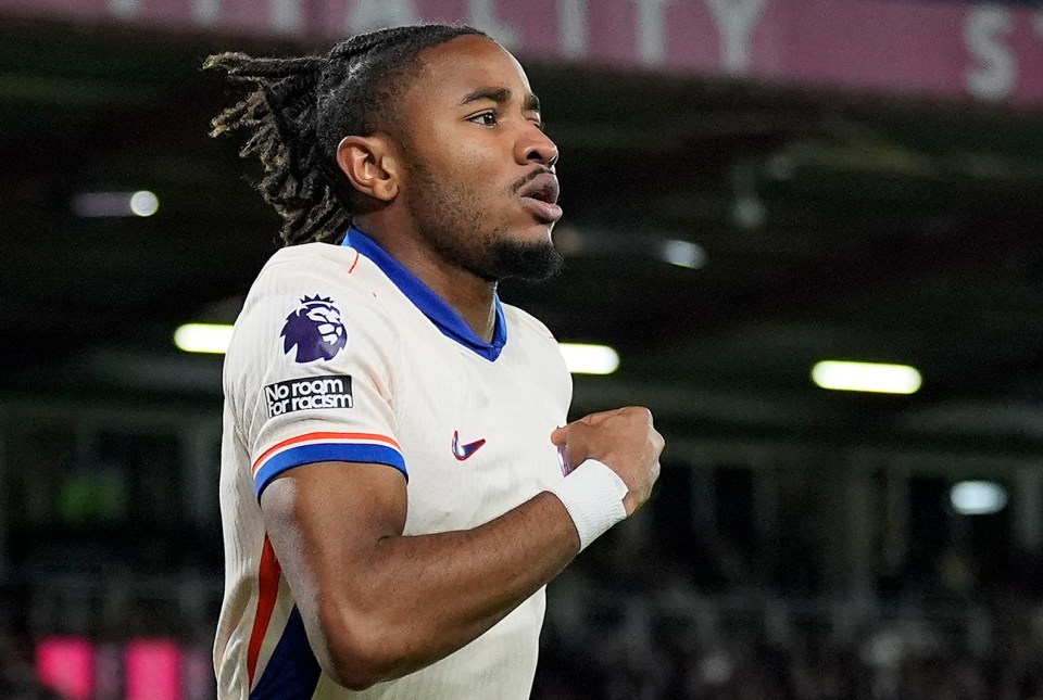 a soccer player wearing a jersey that says no room for racism