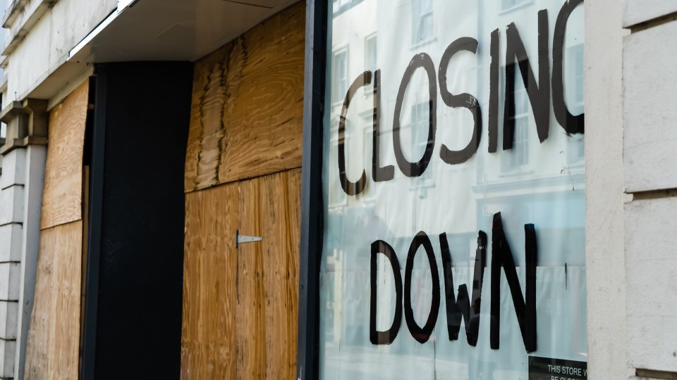 a store front with a sign that says closing down