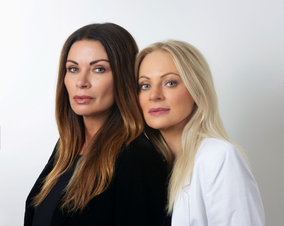 two women standing next to each other with one wearing a white jacket