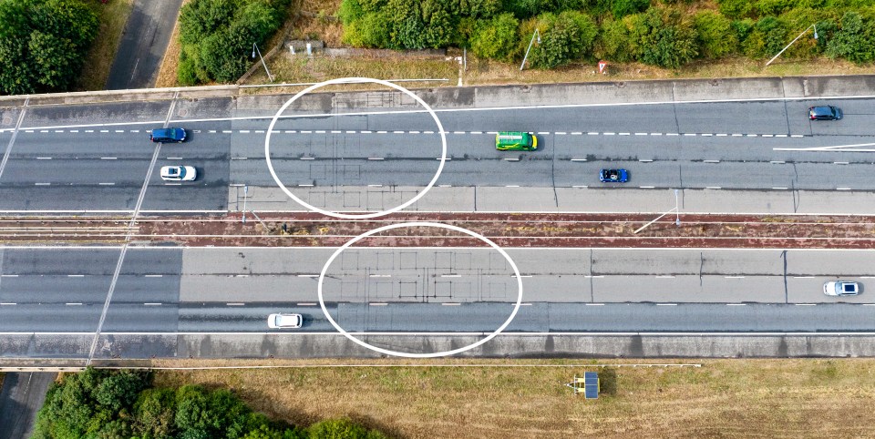 an aerial view of a highway with two circles in the middle