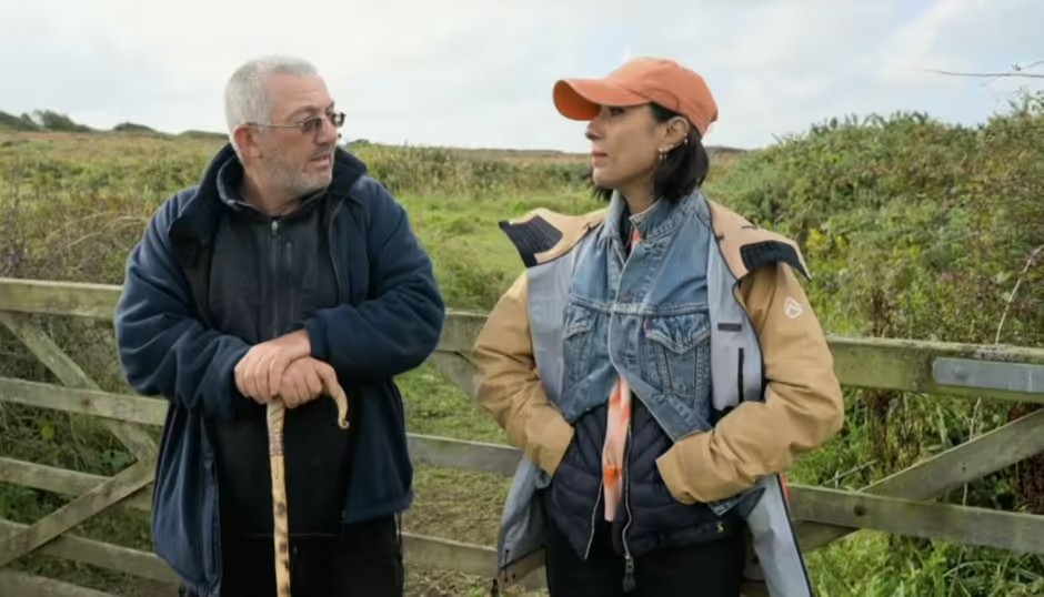 a man and a woman are standing next to each other