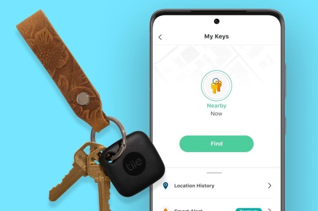 a tile key finder is next to a pair of keys